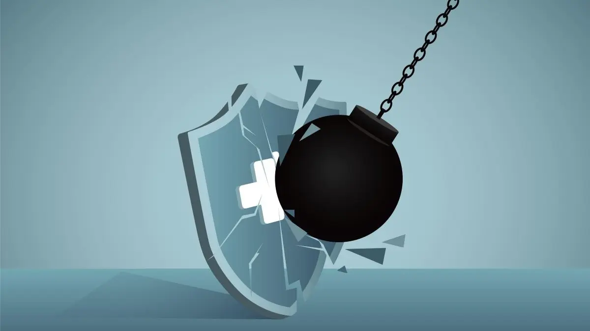 Illustration einer Abrissbirne, die ein medizinisches Schutzschild zerstört – Symbol für Datenschutzverletzung im Gesundheitswesen